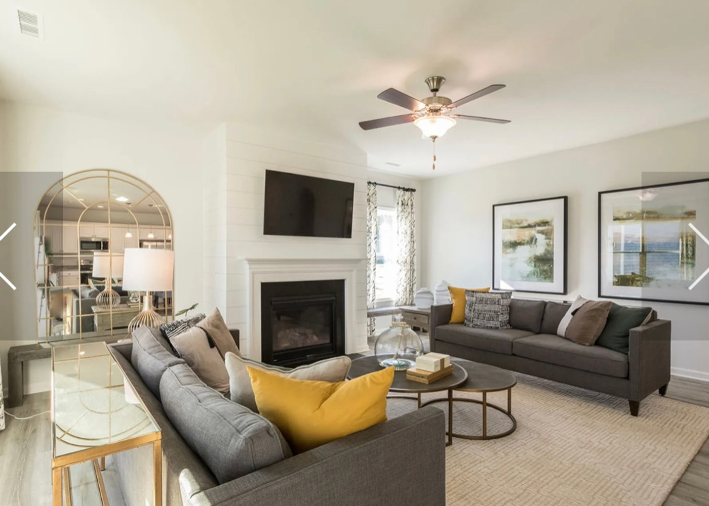 Open-plan living room with fireplace and sectional